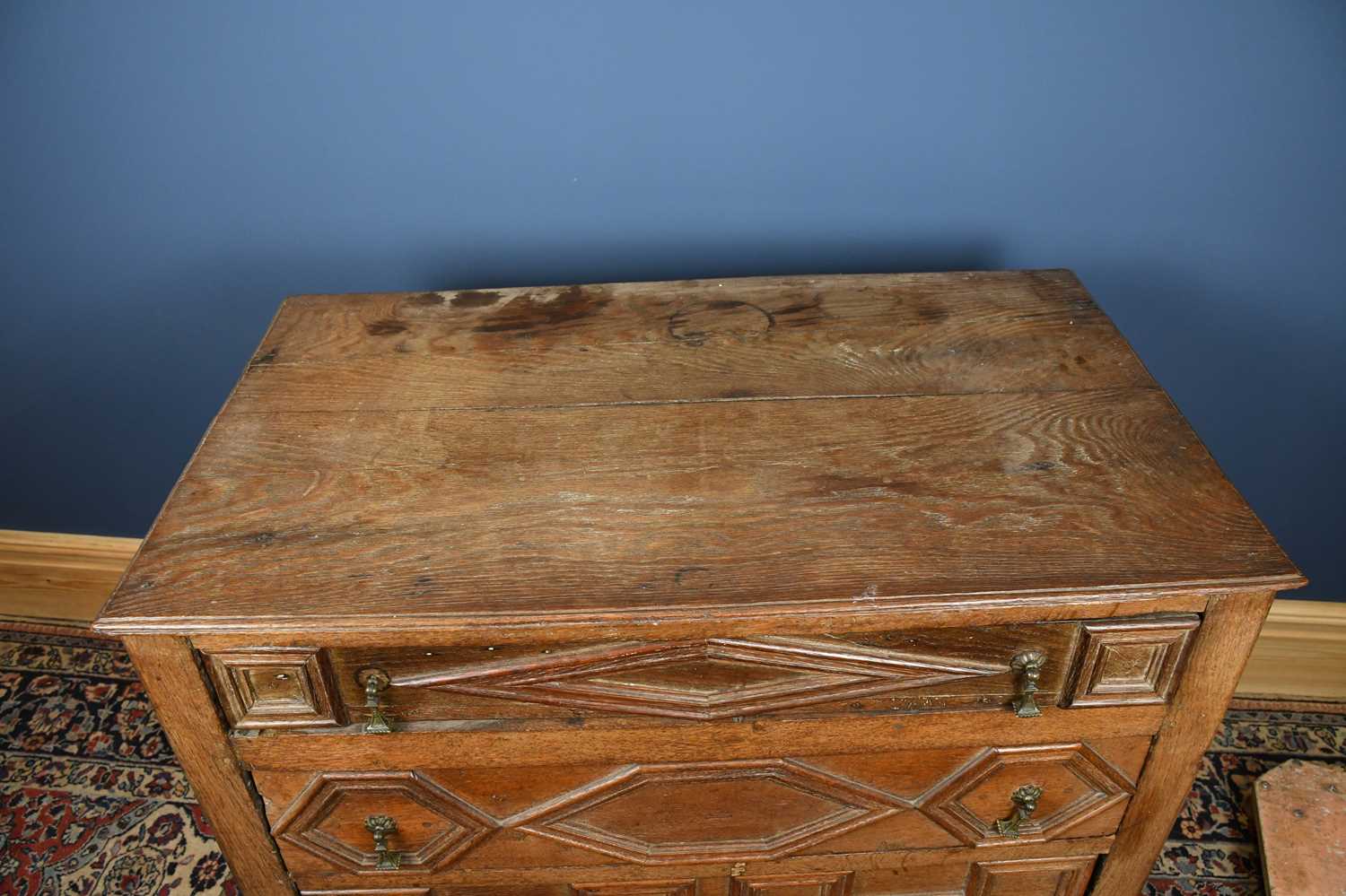 A 17th century and later oak chest, with four fielded panelled long drawers, on turned feet, - Image 2 of 5