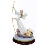LLADRO; a ceramic figure of an angel on a gondola, with oval stand, height 37cm.Condition Report: