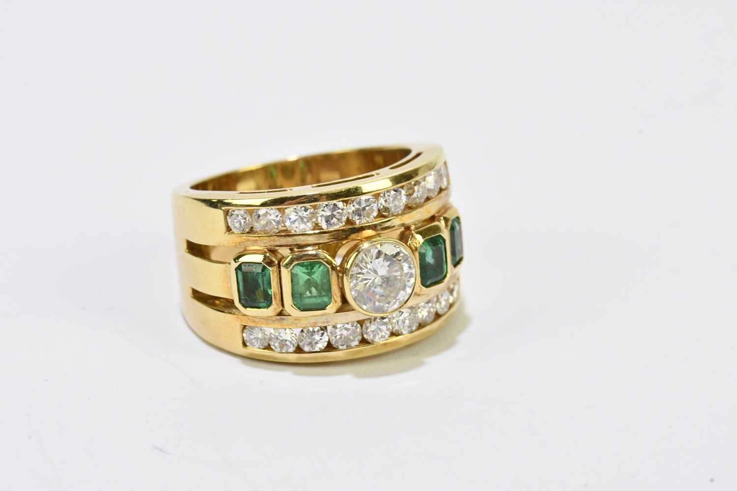 A yellow metal diamond and emerald three band ring, centred with a round brilliant cut collet set - Image 2 of 3