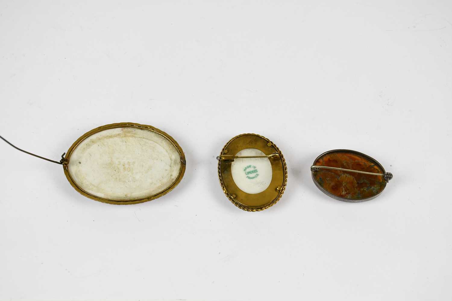 A Continental gilt metal mounted porcelain brooch decorated with four muses, length 6.5cm, with a - Image 2 of 2