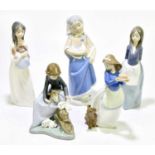 NAO; four assorted figures to include a girl seated with bunnies on her lap, height 15cm, also a