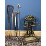 A Victorian cast iron umbrella stand, with portrait roundel to the top, height 84cm.