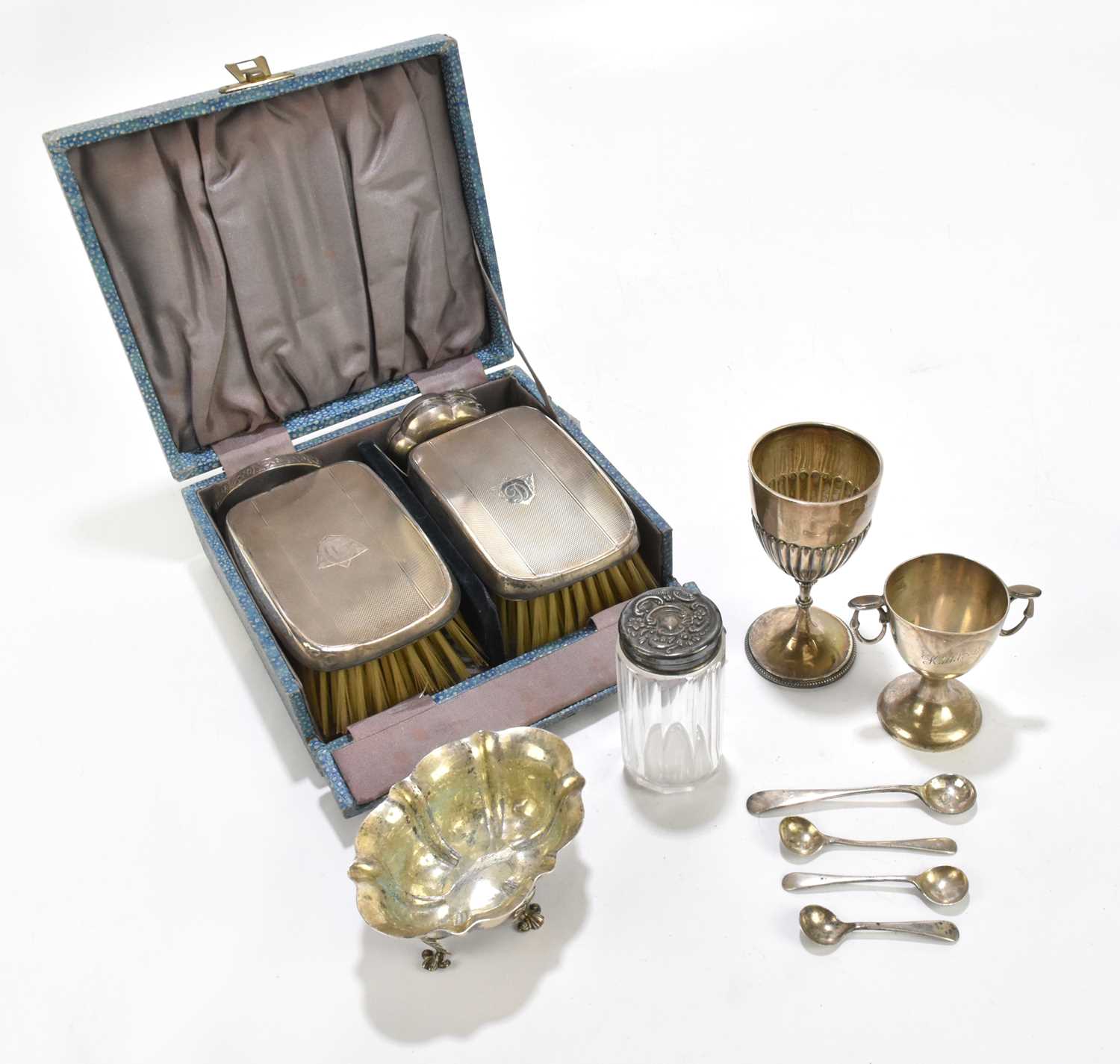 A mixed collection of various hallmarked silver items to include two handbrushes, a pill box, a twin