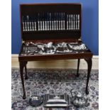 A mahogany veneered canteen of silver plated cutlery in the King's pattern, with leather inset top