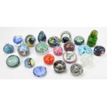 A collection of twenty assorted glass paperweights to include Caithness examples, also a Mdina