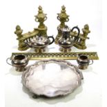 A cast brass fender decorated with a pair of twin handled urns, width 94cm, and a silver plated four