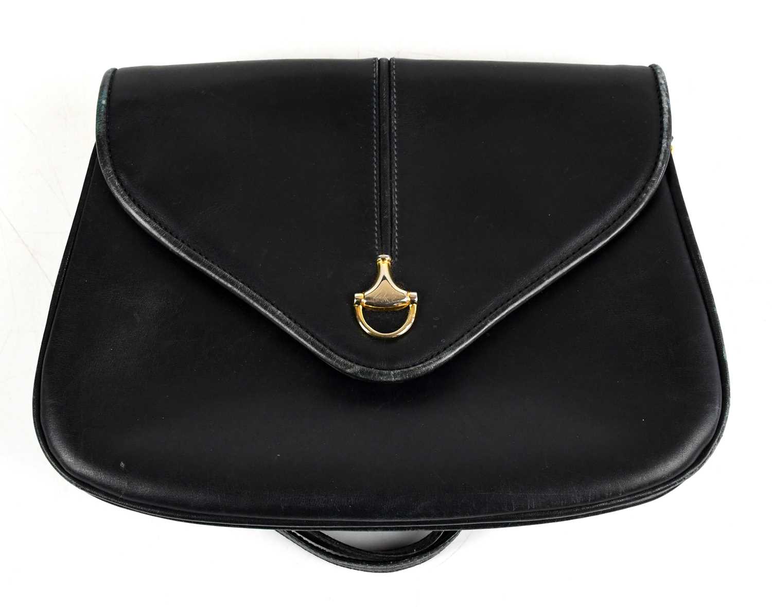 GUCCI; a vintage blue leather shoulder bag with gold tone horse bit to front, maker's logo to