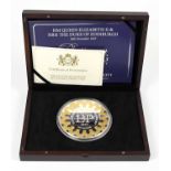 A limited edition 1kilo proof coin celebrating the platinum wedding anniversary of Queen Elizabeth