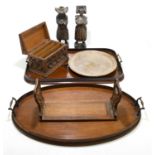 Two Edwardian inlaid mahogany trays with brass handles, the oval example length 58cm, with a