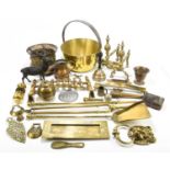 A three piece brass companion set, longest 62cm, a brass preserve pan and other metalware.