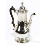 FRANCIS CRUMP; a George II hallmarked silver coffee pot of baluster form, with spiral pineapple