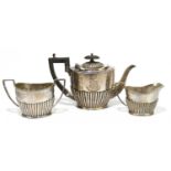 MARK WILLIS; a Victorian hallmarked silver three piece bachelor service with gadrooned decoration to