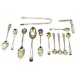 A group of small silver, majority teaspoons and cruet spoons, also a pair of sugar tongs,