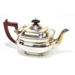 ADIE BROTHERS LTD; a George VI hallmarked silver teapot with cast beaded rim on four ball feet, with