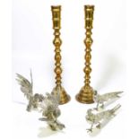 A pair of decorative brass candlesticks, height 55cm, together with a pair of silver plated