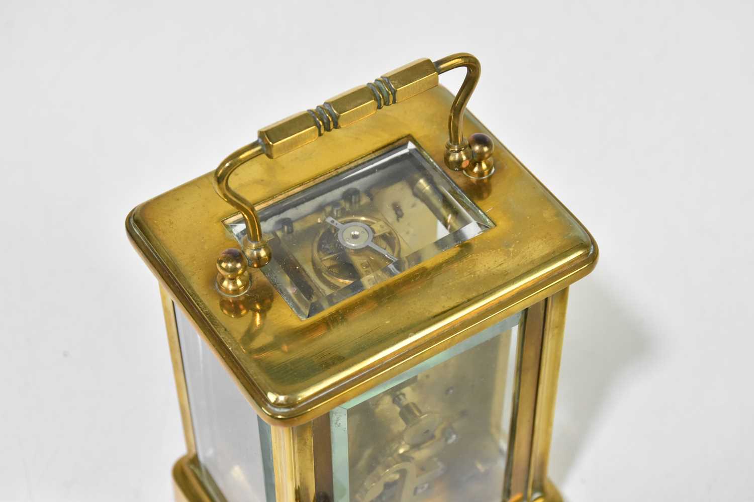 A late 19th century French lacquered brass carriage time piece, with enamelled Roman numeral dial - Image 6 of 6