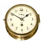 SMITHS; a brass cased ship's style astral clock, the dial set with Arabic numerals, diameter 18cm.