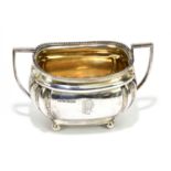 MARK WILLIS & SON; an Edward VII hallmarked silver twin handled sugar bowl, with cast rim and gilded