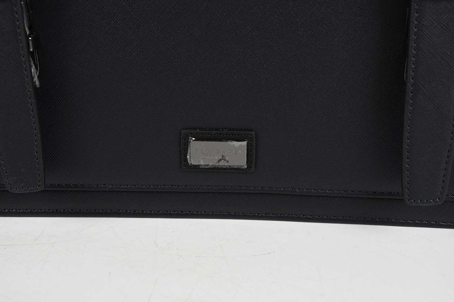 TED BAKER; an unused navy blue faux leather satchel, with front flap and two silver tone buckle - Image 5 of 5