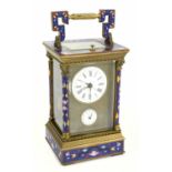 A reproduction brass enamel decorated repeating carriage clock with Roman numerals to the white