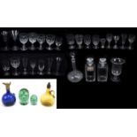 A collection of 18th century and later ceramic glasses and decanters, including a large conical