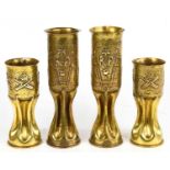 Two pairs of brass trench art vases, with embossed detailing, tallest 30cm.