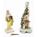 DERBY; an 18th century porcelain figural candlestick modelled with the god Mars against a bocage