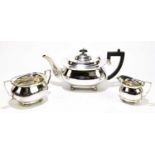 A George V and later matched three piece tea service, of oval form, on bun feet, Sheffield 1929-