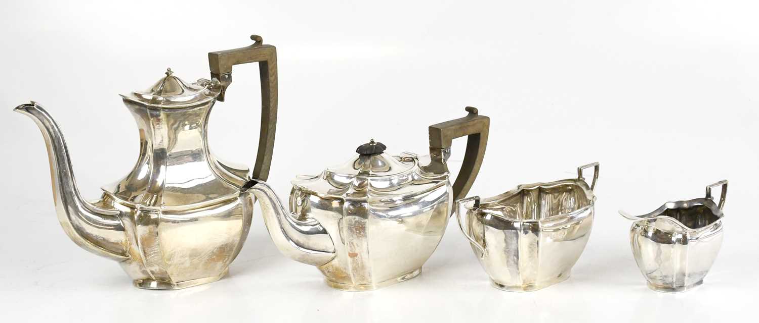 KEIGHT & CO; a hallmarked silver four piece tea service comprising teapot, water pot, milk jug and