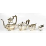 KEIGHT & CO; a hallmarked silver four piece tea service comprising teapot, water pot, milk jug and