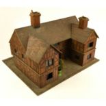 A bespoke pitch pine doll's house, modelled as a tavern, with various small accessories, length