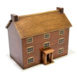 A contemporary painted wooden two division tea caddy in the form of a three storey house with
