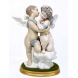 LLADRO; a ceramic figure group of two cherubs, signed and numbered 3697, height 29cm, on an oval