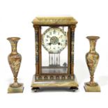 A 19th century French onyx and champleve enamel three piece clock garniture, the four glass clock of