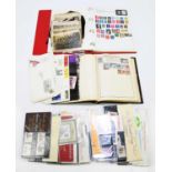 A collection of assorted stamps and first day covers, loose and in albums.