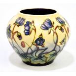 EMMA BOSSONS FOR MOORCROFT; a squat bowl decorated in the 'Hepatica' pattern, height 11cm.