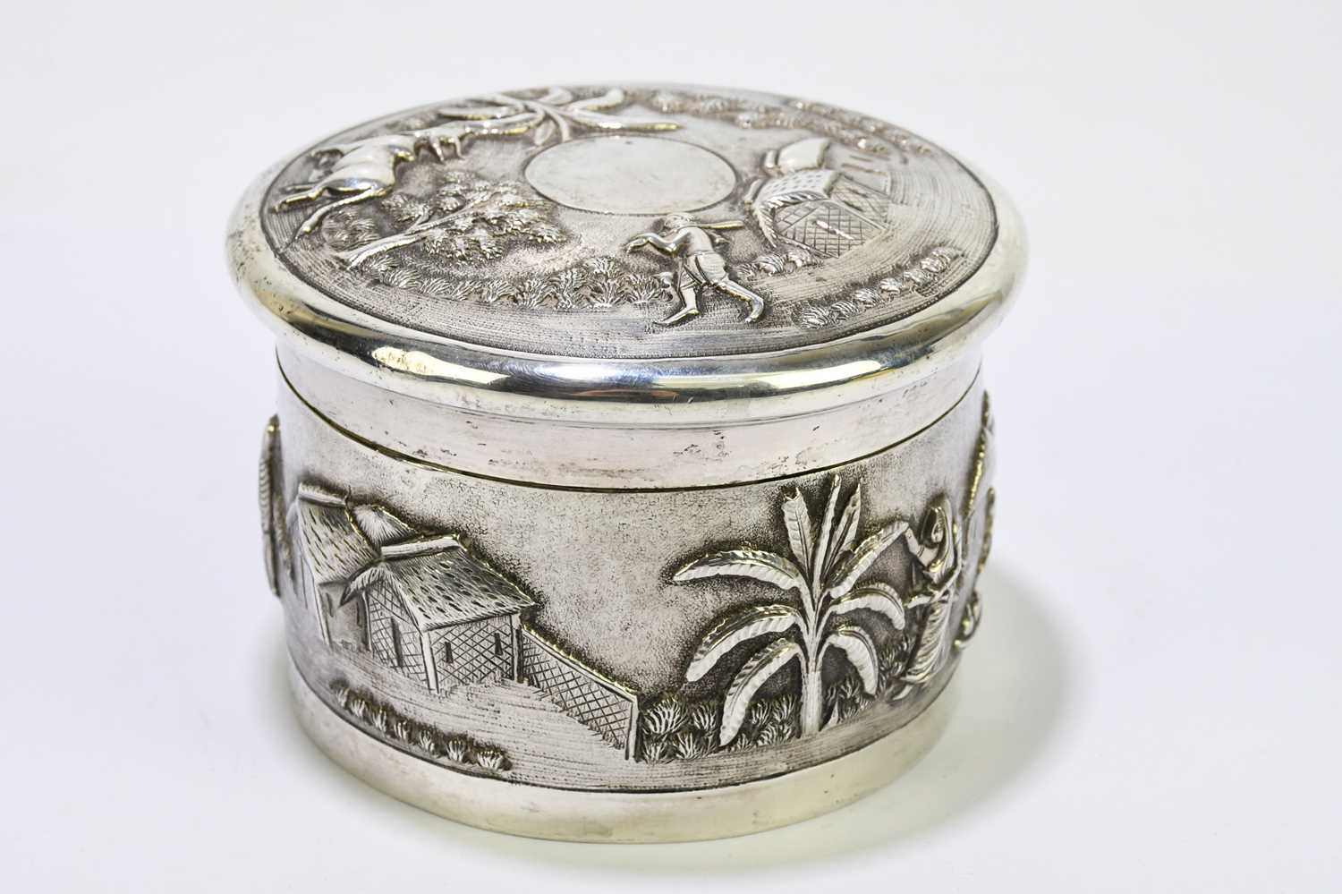 An Indian white metal lidded trinket box, decorated with village scenes. - Image 2 of 5