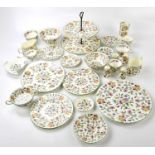 MINTON; a 'Haddon Hall' pattern part dinner and tea service, sixty-three pieces, including a large