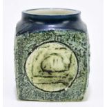 SIMONE KILBURN FOR TROIKA POTTERY; a marmalade jar with embossed stylised decoration on a green