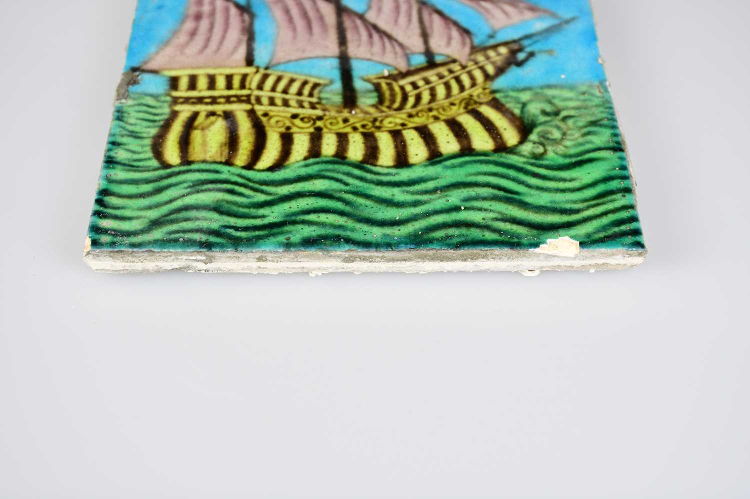 WILLIAM DE MORGAN; an Art Pottery tile painted with a four masted galleon ship, in shades of purple, - Image 3 of 6