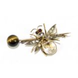 A novelty yellow metal insect brooch with tiger's eye sphere attached to the bar, length approx.