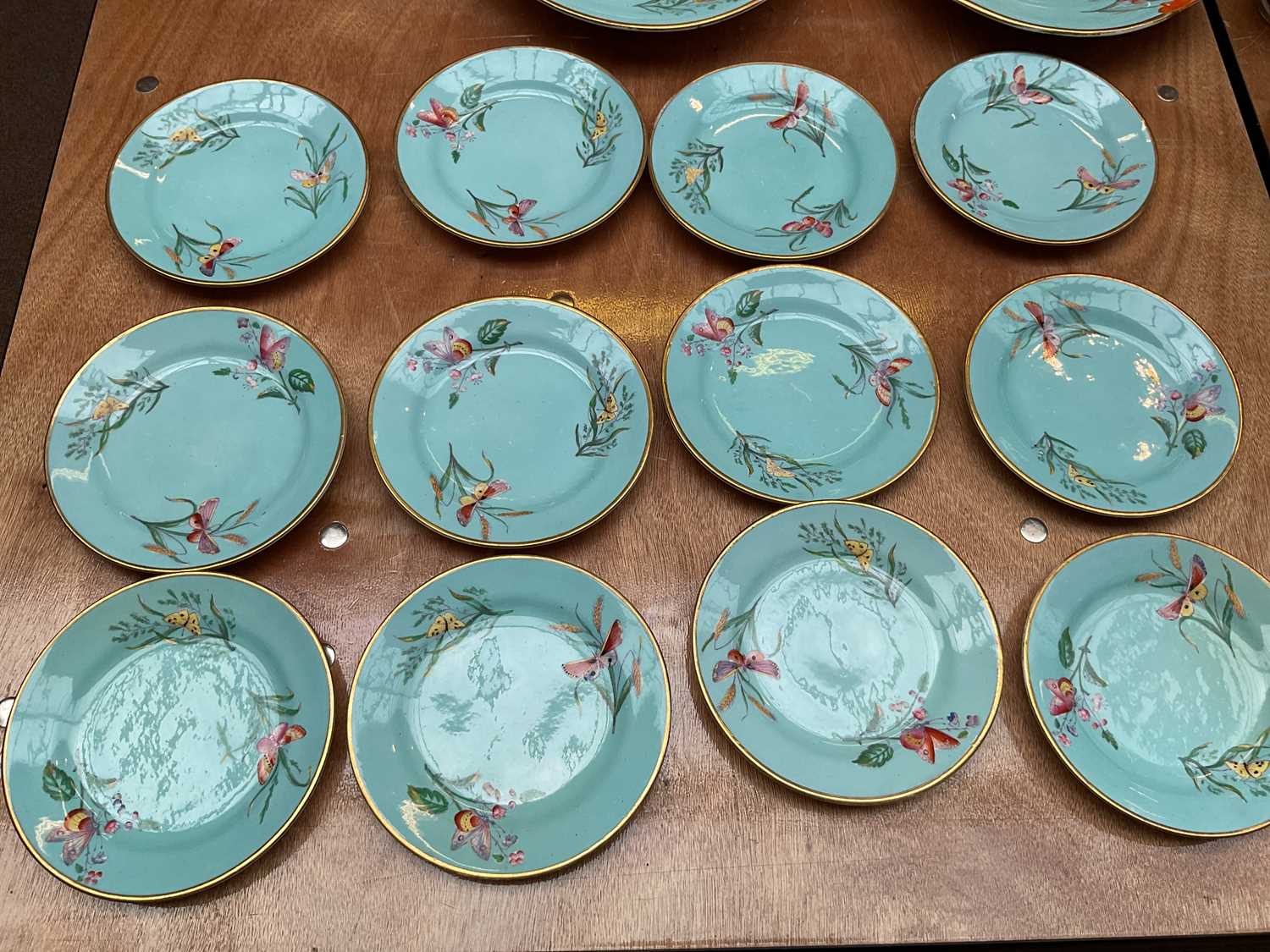 A 19th century English bone china thirty-eight piece part tea service, decorated with butterflies - Image 8 of 9