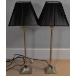 A pair of modern silver plated table lamps with pleated black shades, height to top of shade 84cm (