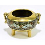 A Chinese bronze and enamel circular censer, with twin handles, height 7cm.