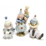 LLADRO; three figures of clowns comprising 5812, 5811 and another of a seated clown with a puppy,