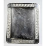 An Arts and Crafts electroplate frame, with floral and pierced decoration around the sides, 32 x