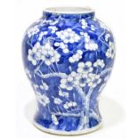 A 19th century Chinese blue and white porcelain vase painted with prunus flowers, height 22cm.