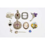 A collection of eleven examples of costume jewellery to include a paste set brooch in Regency style,