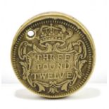 A £3 12 shilling brass coin weight.