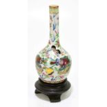 A late 19th century Chinese Canton Famille Rose bud vase, with clobbered decoration of a four claw